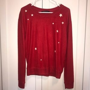 Red sweater with white stars.